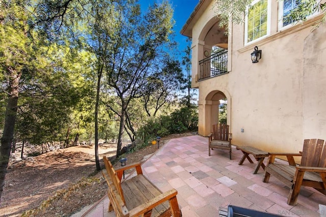 view of patio / terrace with a balcony