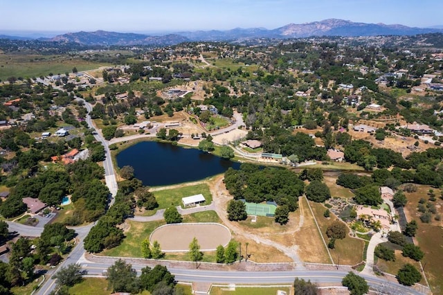 bird's eye view with a water and mountain view