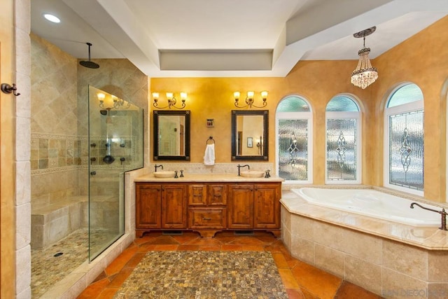 bathroom with vanity and independent shower and bath