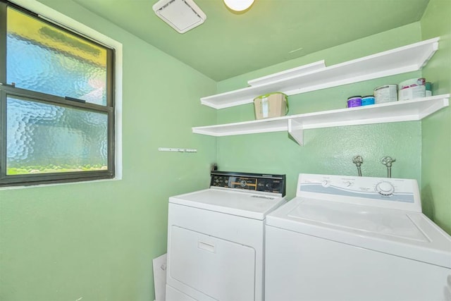 laundry area featuring washing machine and clothes dryer