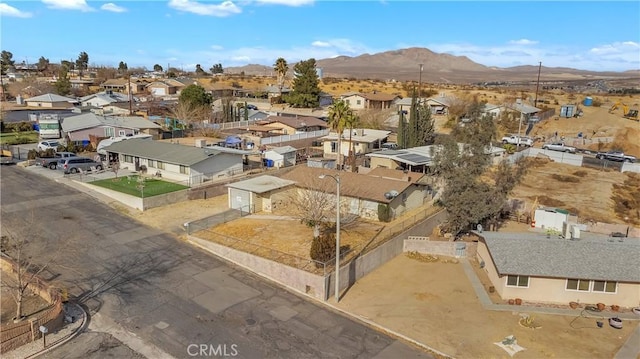 birds eye view of property featuring a mountain view