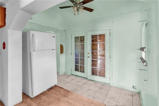 interior space featuring ceiling fan and french doors