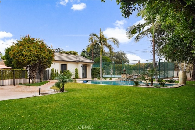 view of yard featuring a patio area and a fenced in pool