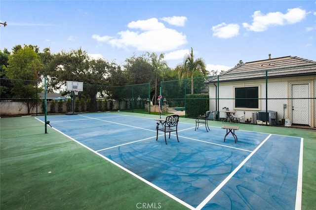 view of sport court with basketball hoop