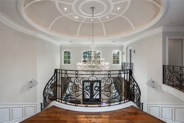 hallway featuring a chandelier and ornamental molding