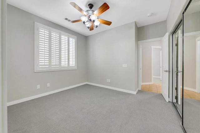 interior space featuring ceiling fan