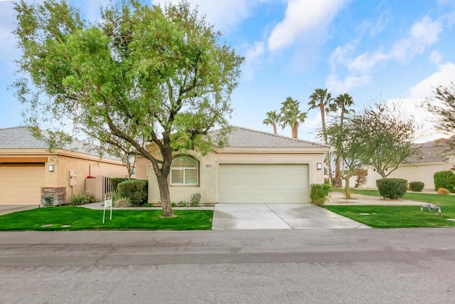 mediterranean / spanish-style home with a garage and a front yard