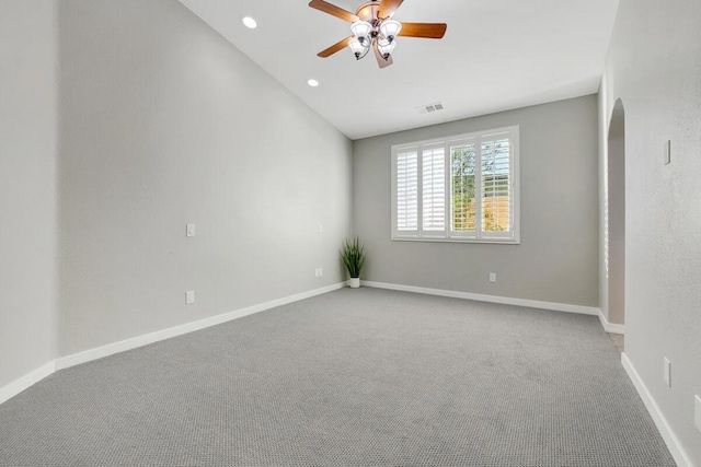 spare room with carpet flooring, ceiling fan, and lofted ceiling