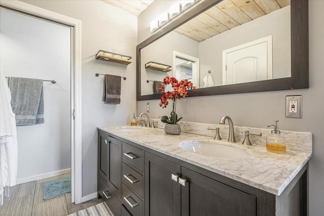 bathroom featuring vanity and wooden ceiling