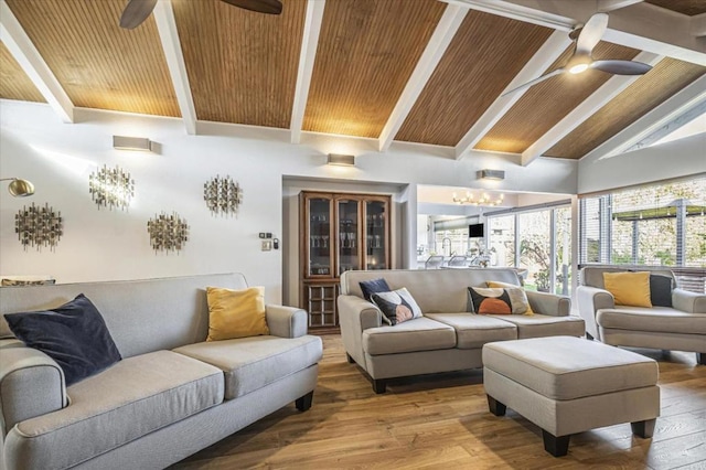 living room with hardwood / wood-style flooring, wooden ceiling, and ceiling fan