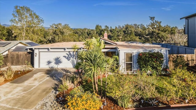 ranch-style home with a garage