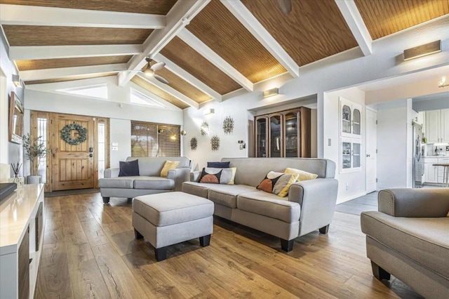 living room featuring wood ceiling, lofted ceiling with beams, and light hardwood / wood-style flooring