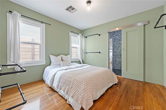 bedroom with wood-type flooring