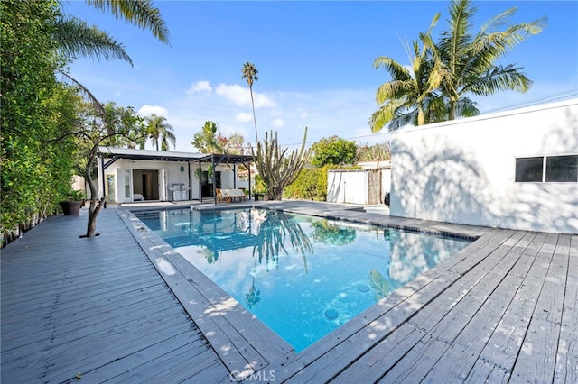 view of swimming pool featuring a deck