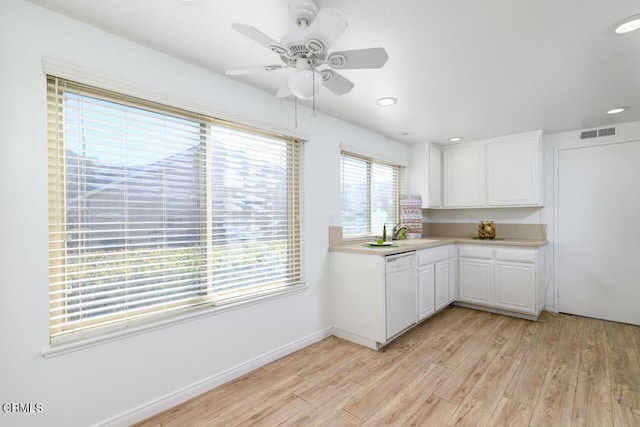 kitchen featuring white dishwasher, plenty of natural light, and light hardwood / wood-style floors