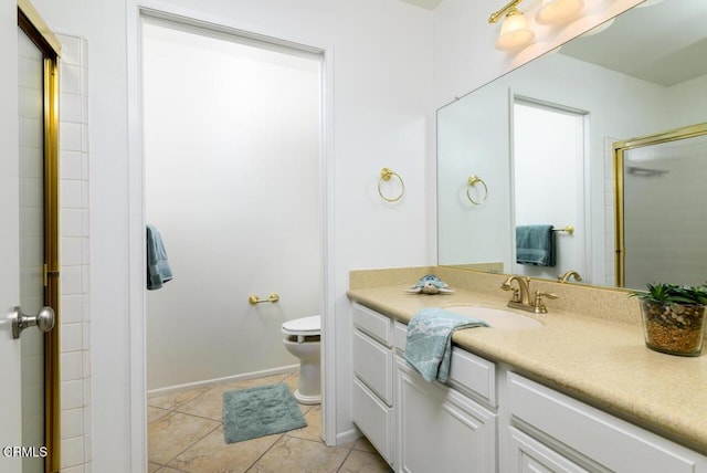 bathroom featuring tile patterned flooring, vanity, toilet, and an enclosed shower