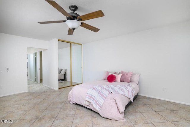 tiled bedroom featuring a closet and ceiling fan