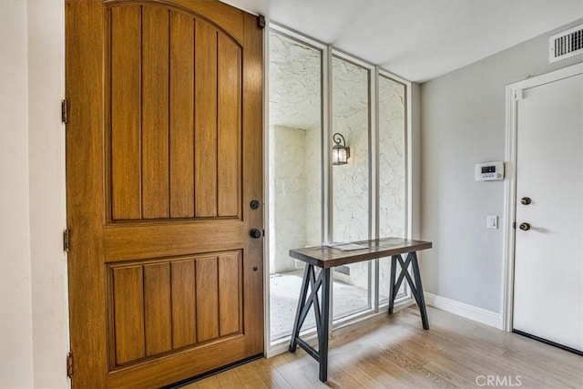 foyer with light hardwood / wood-style flooring