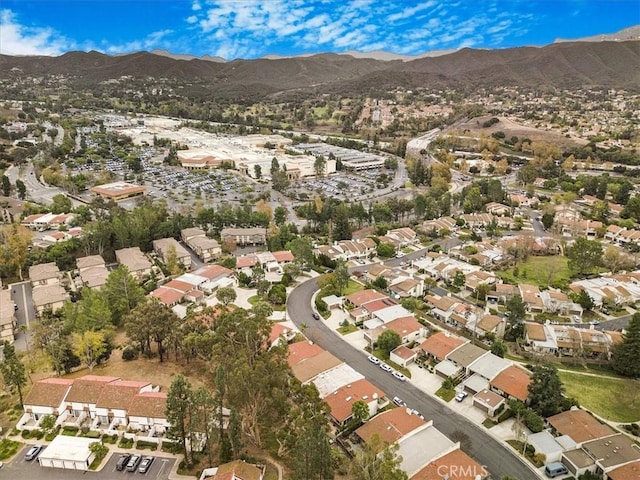 birds eye view of property with a mountain view