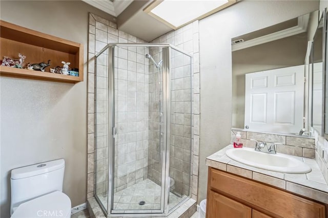 bathroom with vanity, toilet, walk in shower, and crown molding