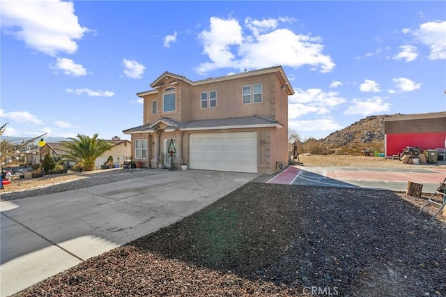 front facade featuring a mountain view and a garage