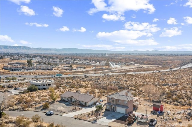 birds eye view of property with a mountain view