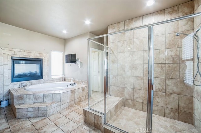 bathroom featuring tile patterned flooring and independent shower and bath