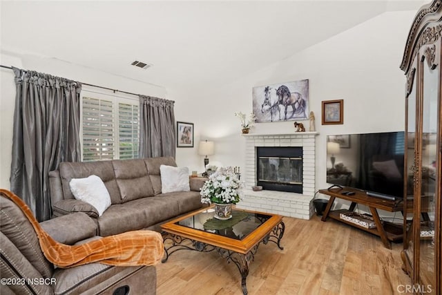 710 Crystal Way, Nipomo, CA 93444 - living area with vaulted ceiling, wood finished floors, and a fireplace
