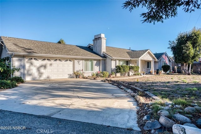 ranch-style home featuring a garage