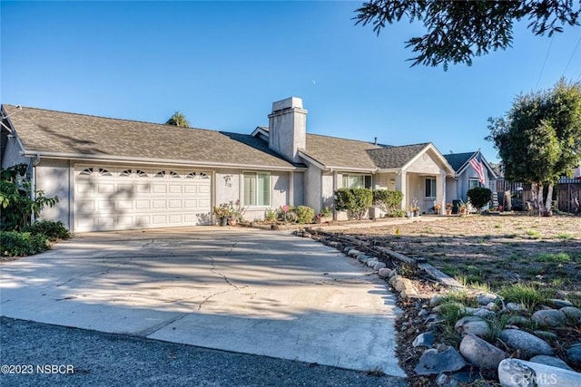710 Crystal Way, Nipomo, CA 93444 - single story home featuring a chimney, a garage, driveway, and stucco siding