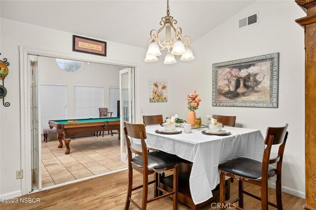 710 Crystal Way, Nipomo, CA 93444 - dining space featuring wood finished floors, a chandelier, vaulted ceiling, and billiards