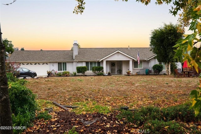 single story home featuring a garage