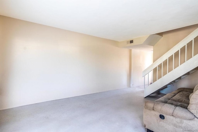 unfurnished living room featuring concrete floors