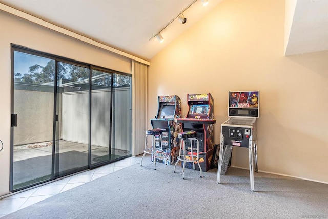 carpeted office featuring rail lighting and vaulted ceiling