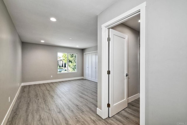 spare room with light wood-type flooring