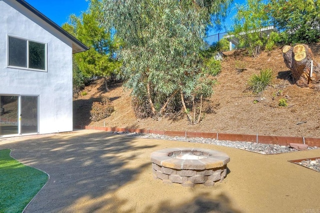 view of patio / terrace featuring a fire pit