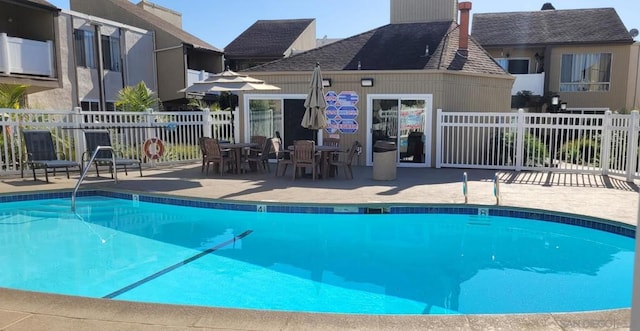 view of swimming pool with a patio