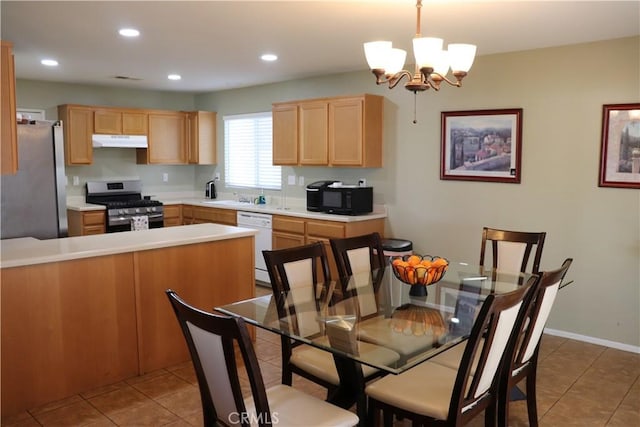 kitchen featuring stainless steel appliances, sink, hanging light fixtures, a notable chandelier, and light tile patterned flooring