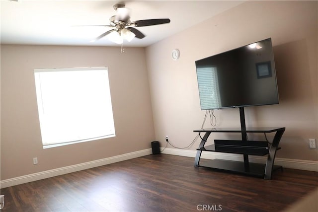 interior space featuring ceiling fan and dark hardwood / wood-style floors