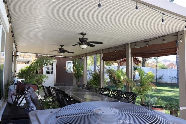 sunroom with ceiling fan