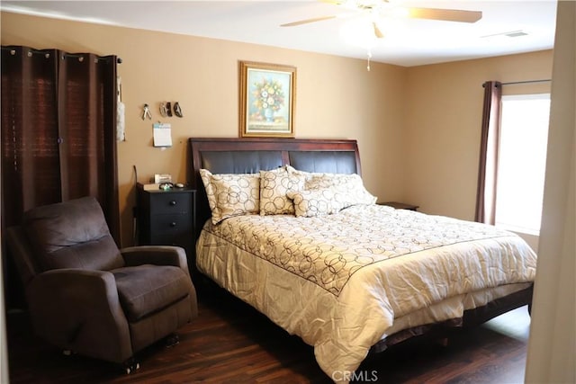 bedroom with dark wood-type flooring and ceiling fan