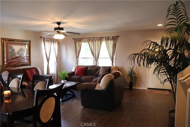 living room with ceiling fan and dark hardwood / wood-style floors