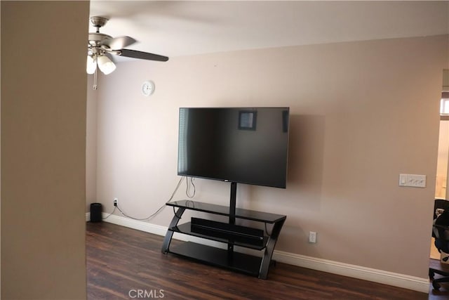 living room with ceiling fan and dark hardwood / wood-style floors