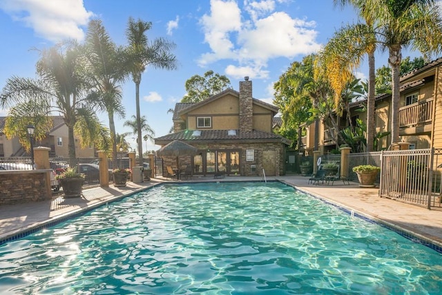 view of swimming pool featuring a patio area