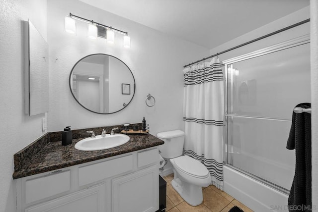 full bathroom with toilet, shower / bath combination with curtain, vanity, and tile patterned floors