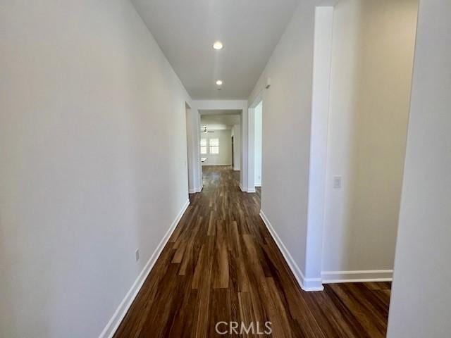 hallway featuring dark wood-type flooring