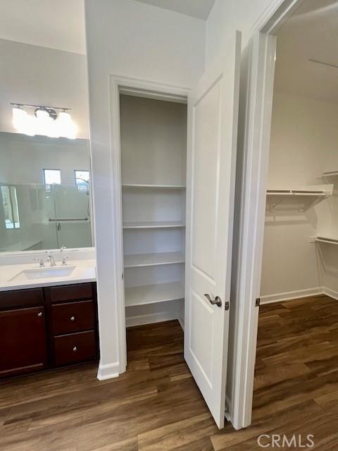 bathroom with vanity and hardwood / wood-style flooring