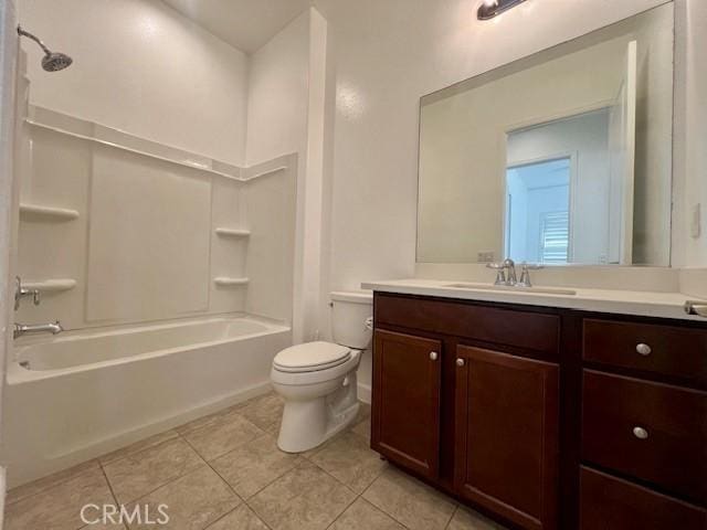 full bathroom featuring toilet, tile patterned floors, vanity, and bathtub / shower combination