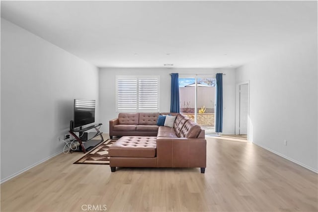 living room with light hardwood / wood-style floors