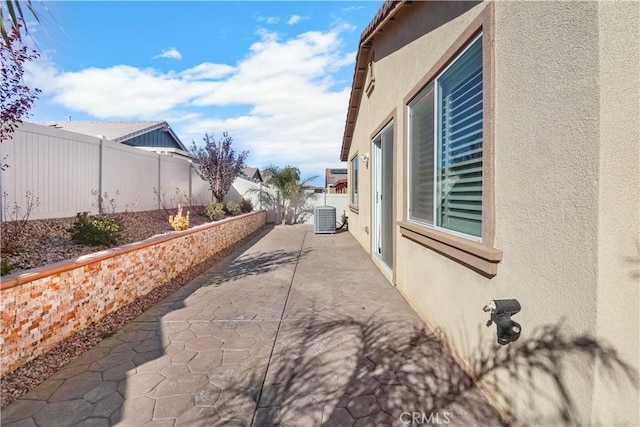 view of home's exterior featuring a patio and central AC